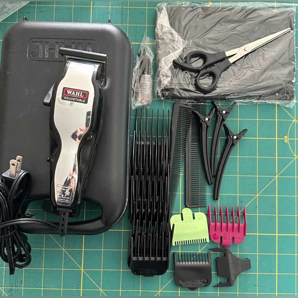 Wahl home hair cutting kit plug in with 12 combs including ear and brow.